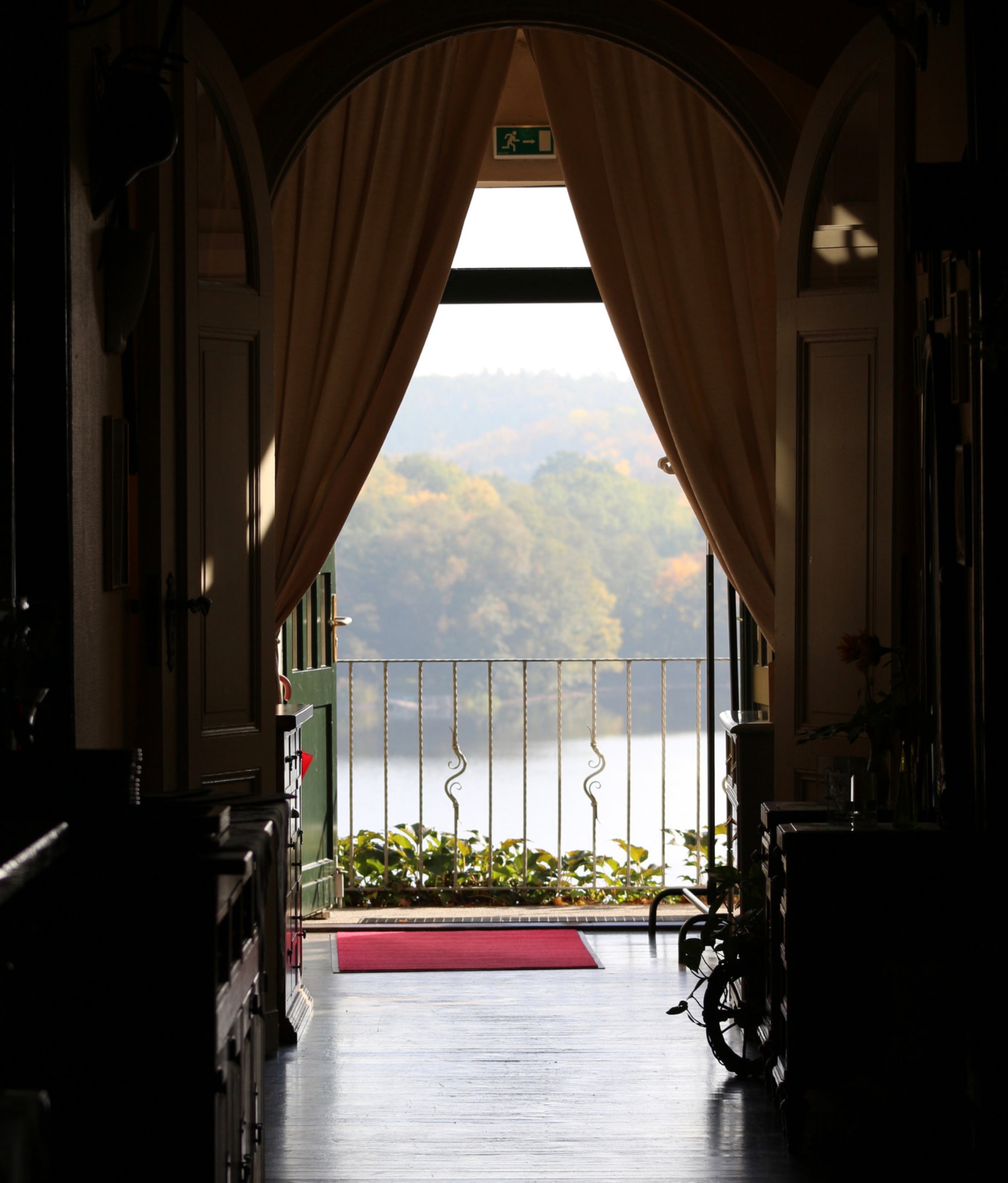 View through open doors onto the lake at Haus am See Chorin